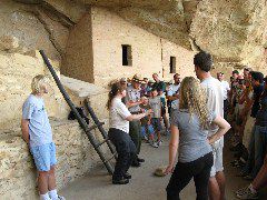 I volunteer to let the tour guide make a fool of me (reinacting the life of a Puebloan woman)