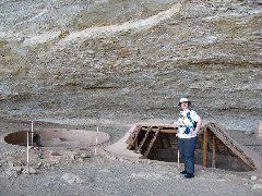 Reconstructed pit houses next to Step House
