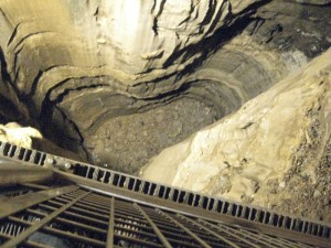 Looking down into the bottomless pit.  I assure you that it was considerably more bottomless in the days before electric lighting and industrial steel catwalks.